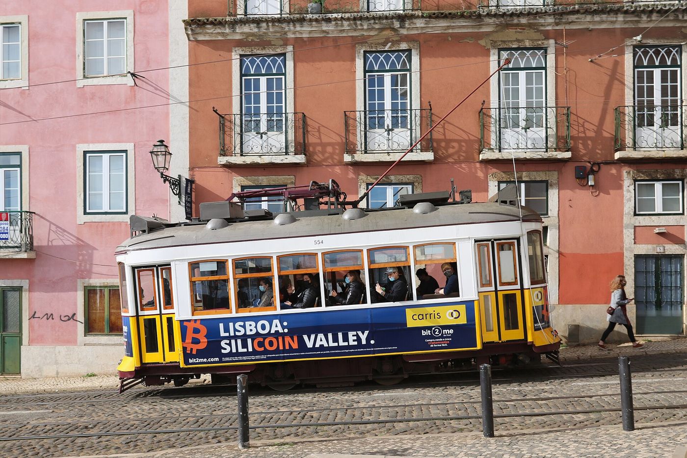A tram climbs through the Alfama district of Lisbon, where nearly a third of apartments are registered as tourist rentals.